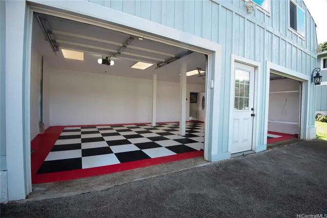 a kitchen with stainless steel appliances kitchen island hardwood floor sink stove table and chairs
