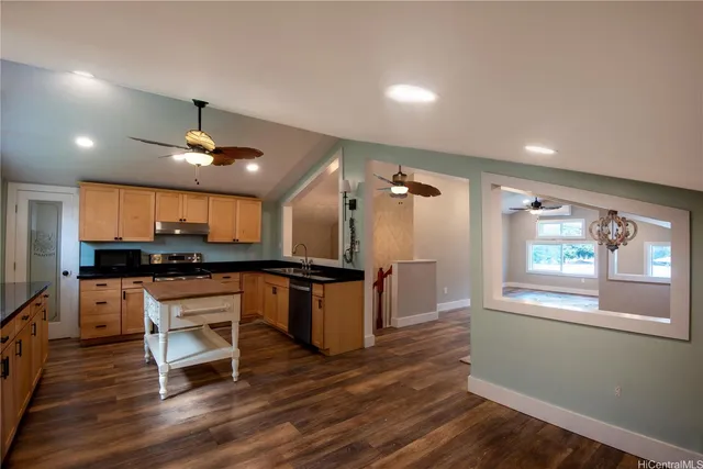 a view of livingroom with hardwood floor and a ceiling fan