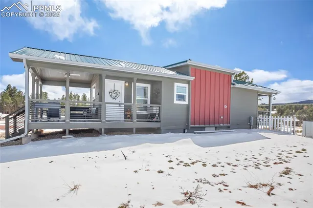 a view of a house with a snow on the road