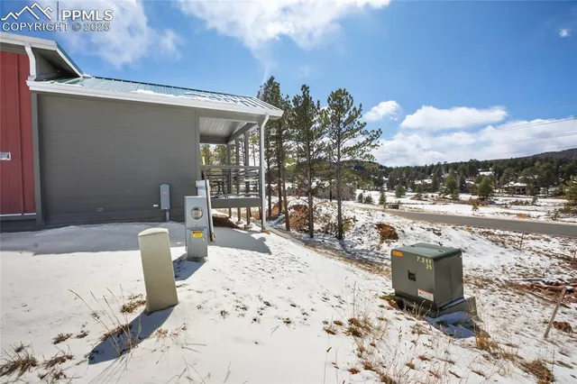 a view of a terrace with lawn chairs