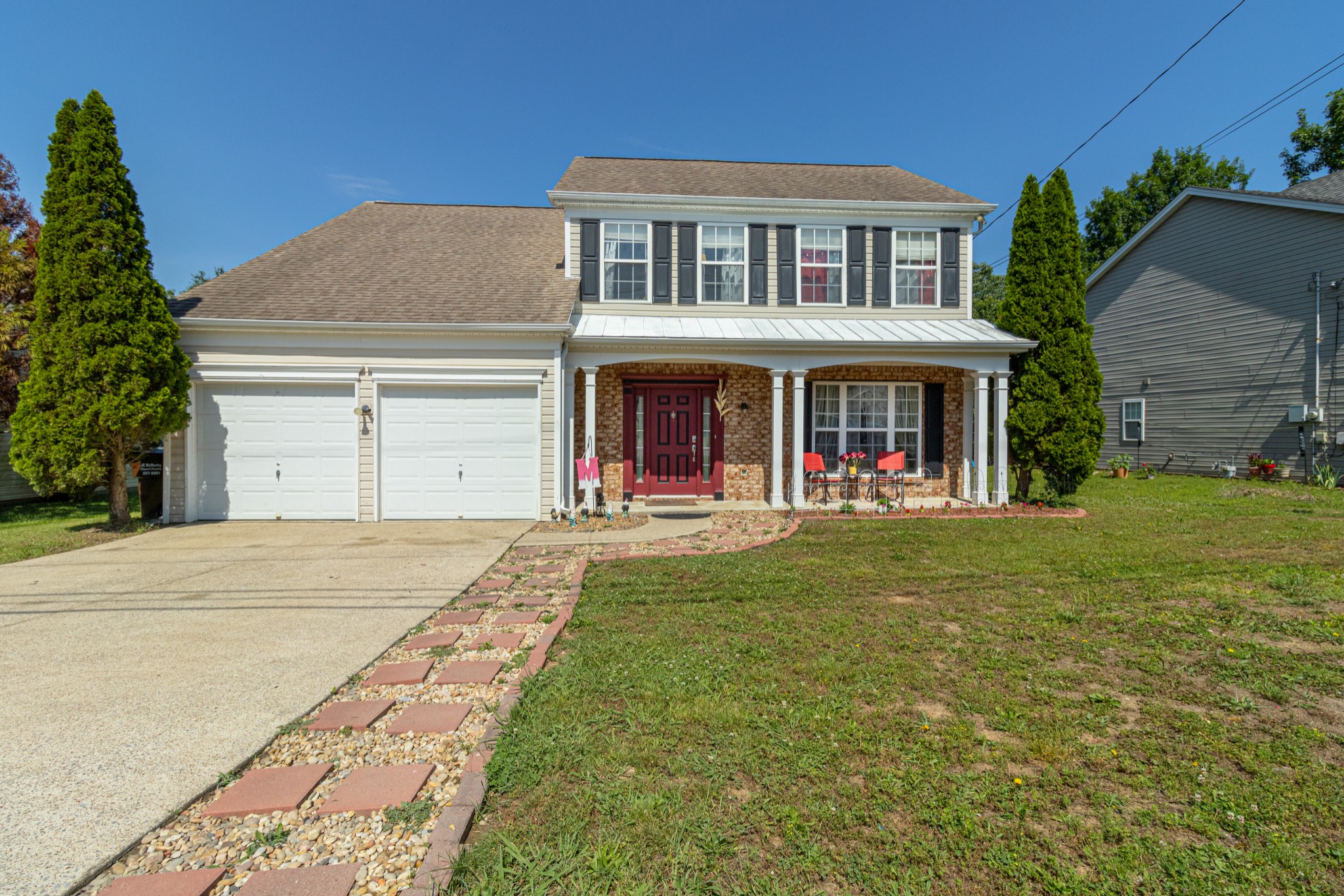 a front view of a house with a yard