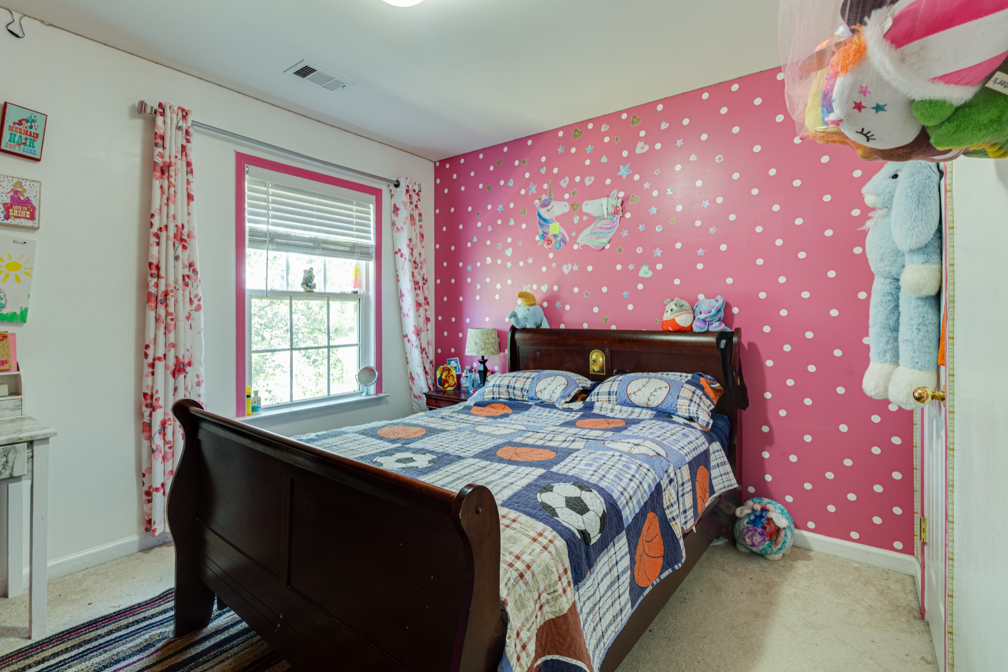 1696 Eagle Trace Drive Mount Juliet, TN 37122 - Photo 17 of 28 a bed sitting in a bedroom next to a window