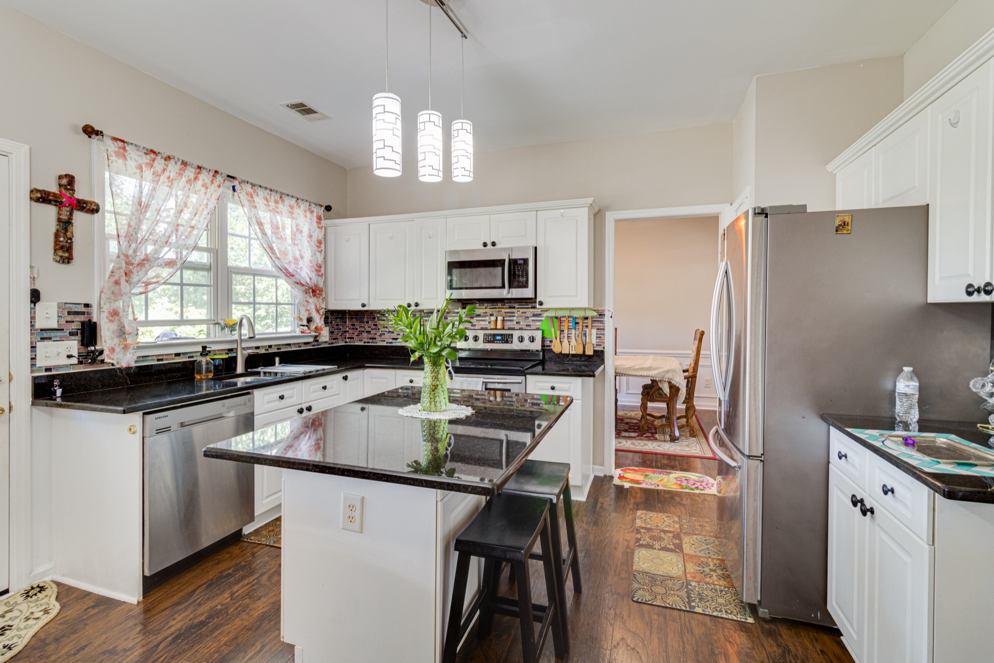 1696 Eagle Trace Drive Mount Juliet, TN 37122 - Photo 8 of 28 a kitchen with stainless steel appliances granite countertop a sink refrigerator and microwave