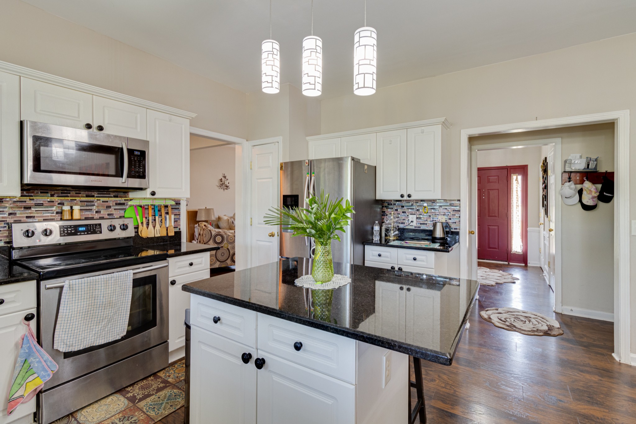 1696 Eagle Trace Drive Mount Juliet, TN 37122 - Photo 9 of 28 a kitchen with a sink stainless steel appliances and white cabinets