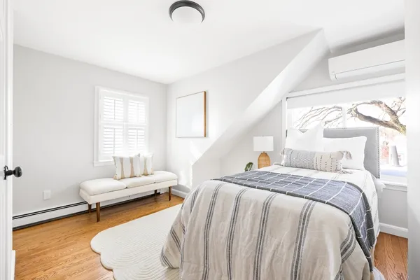 a bedroom with a bed and a couch