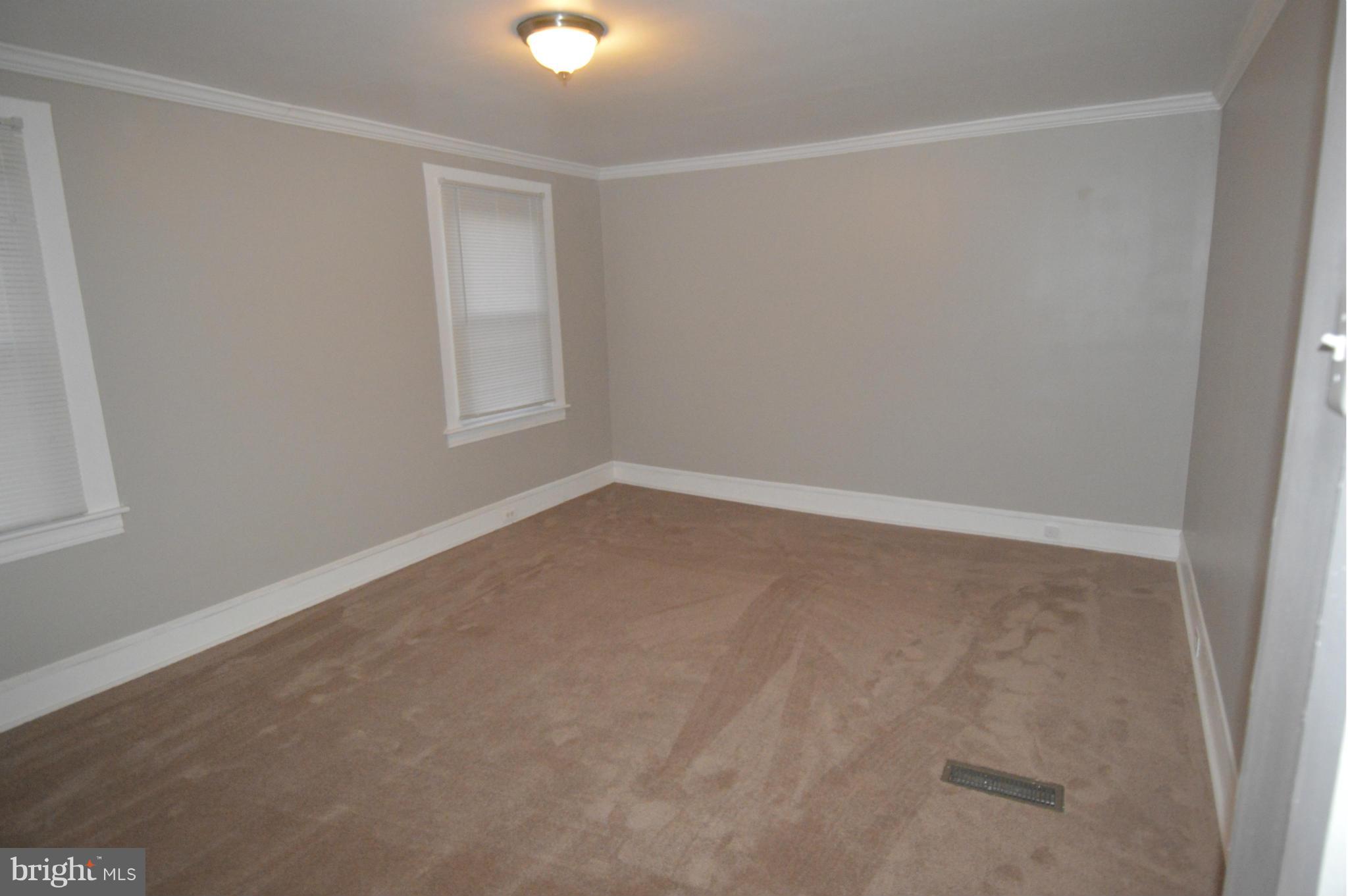 2606 Goodwood Road Baltimore, MD 21214 - Photo 22 of 30 an empty room with a window