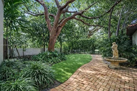 a backyard of a house with outdoor seating