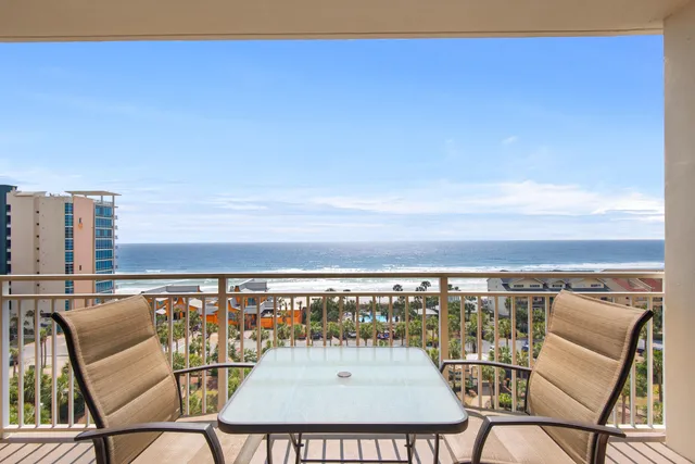 a view of a balcony with an ocean view