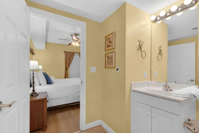 a en suite bathroom with a sink and a mirror