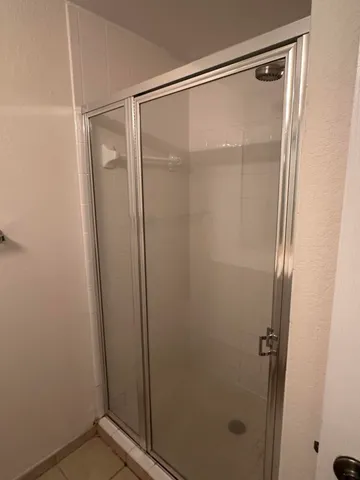 a view of a hallway with windows