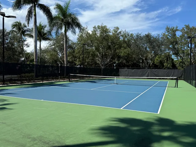 a view of a swimming pool and lounge chair