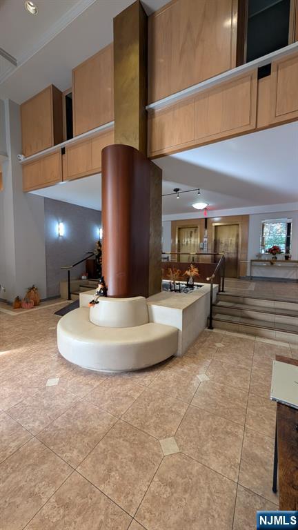 125 Prospect Avenue, Unit 10C Hackensack, NJ 07601 - Photo 23 of 23 a lobby with furniture and a lamp