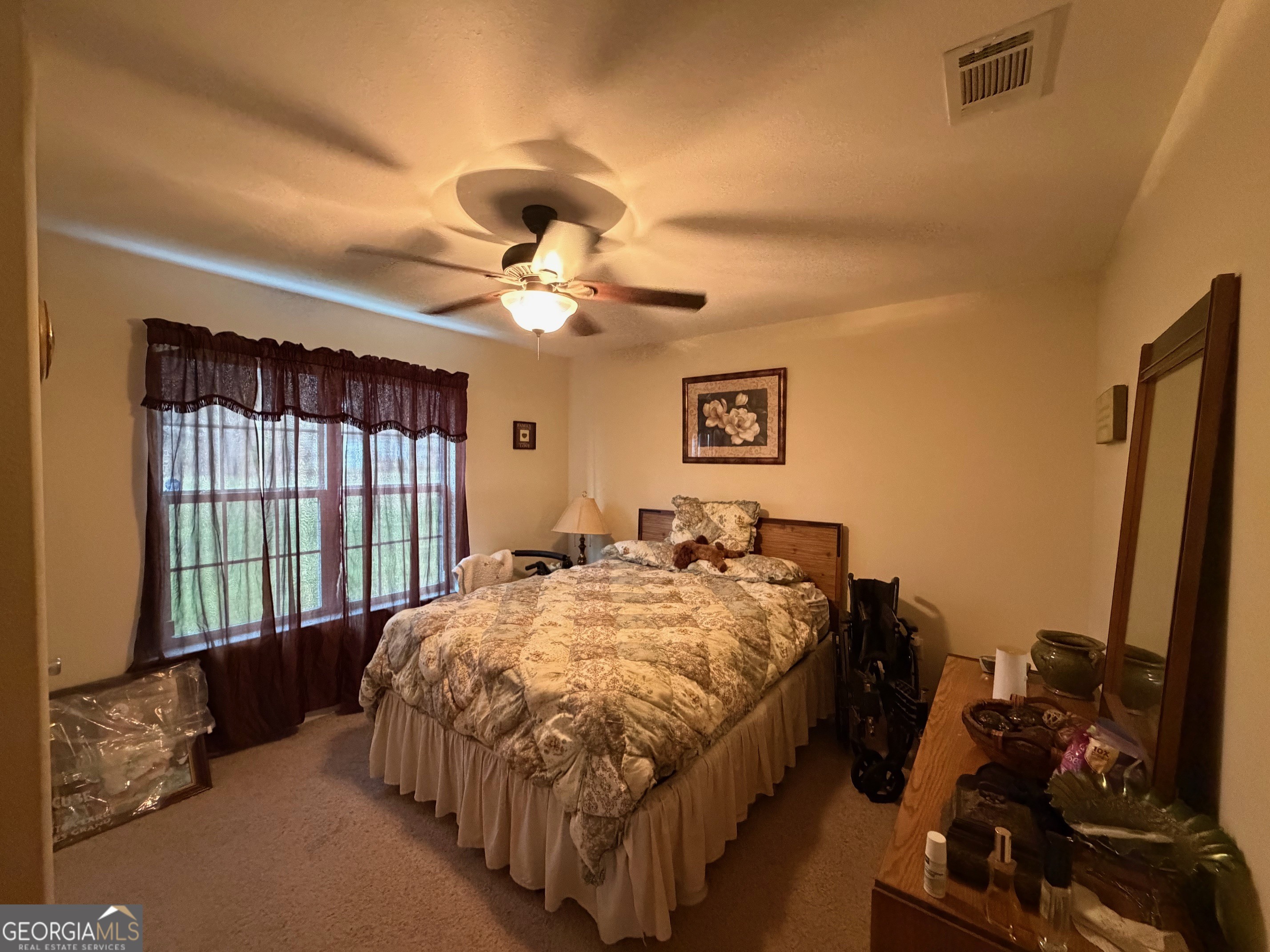 257 Mountain Laurel Road Nashville, GA 31639 - Photo 16 of 41 a bed sitting in a bedroom next to a window