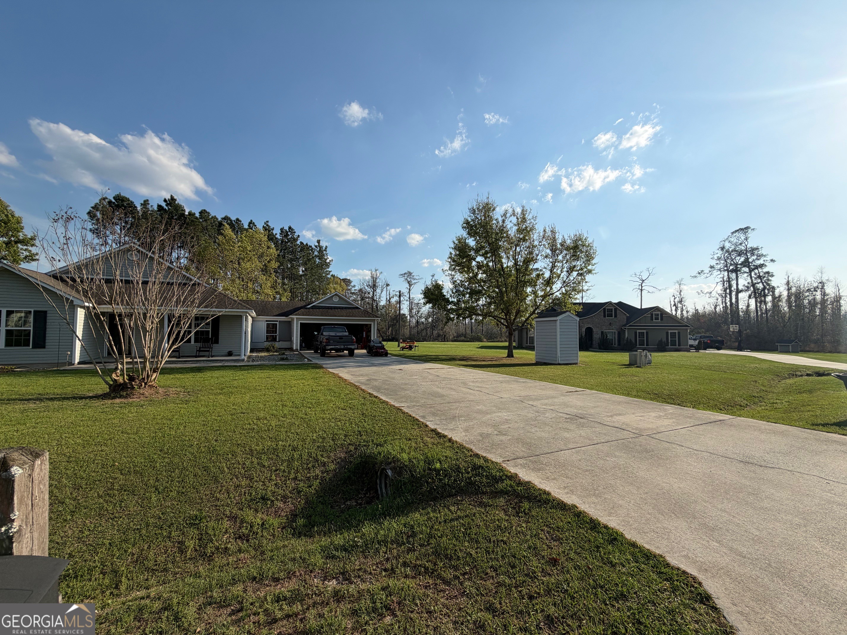 257 Mountain Laurel Road Nashville, GA 31639 - Photo 2 of 41 a view of a big house in a big yard with large trees