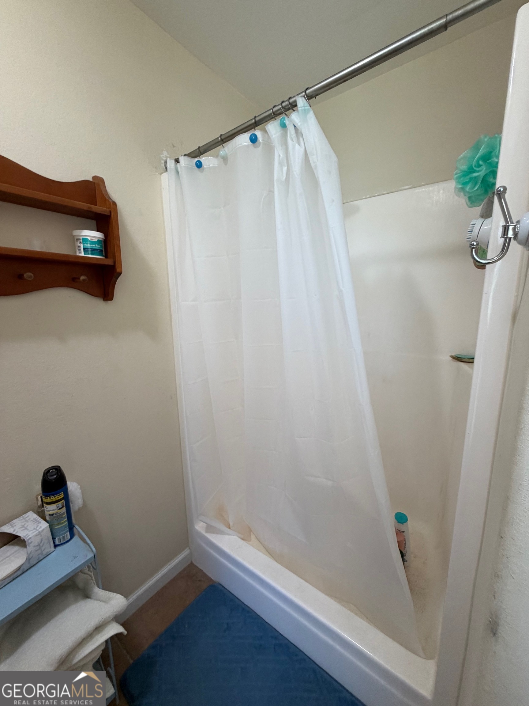 257 Mountain Laurel Road Nashville, GA 31639 - Photo 27 of 41 a bathroom with a shower curtain and a sink
