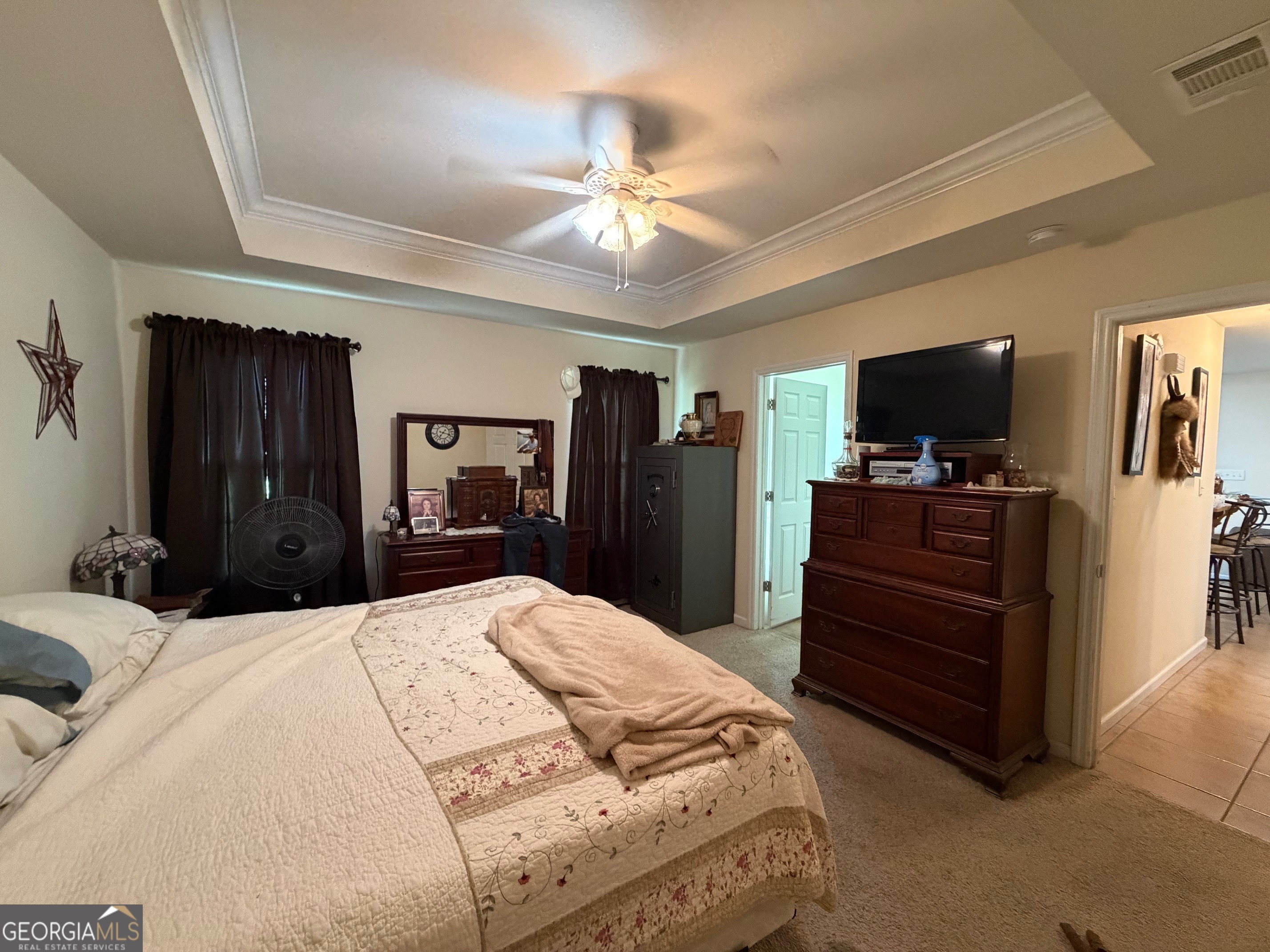 257 Mountain Laurel Road Nashville, GA 31639 - Photo 30 of 41 a bedroom with a bed and a flat tv screen on dresser
