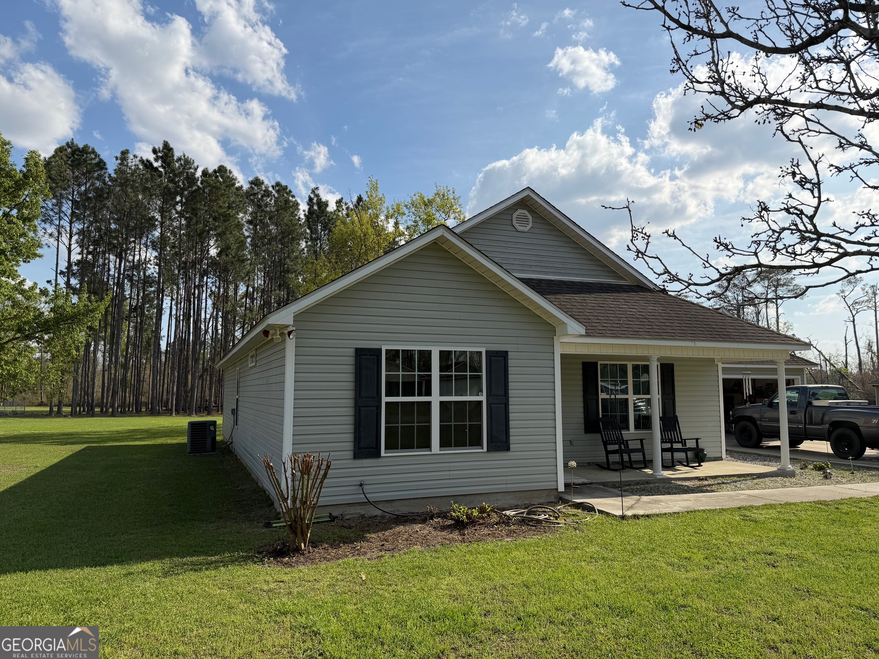 257 Mountain Laurel Road Nashville, GA 31639 - Photo 3 of 41 a view of house with backyard and outdoor seating
