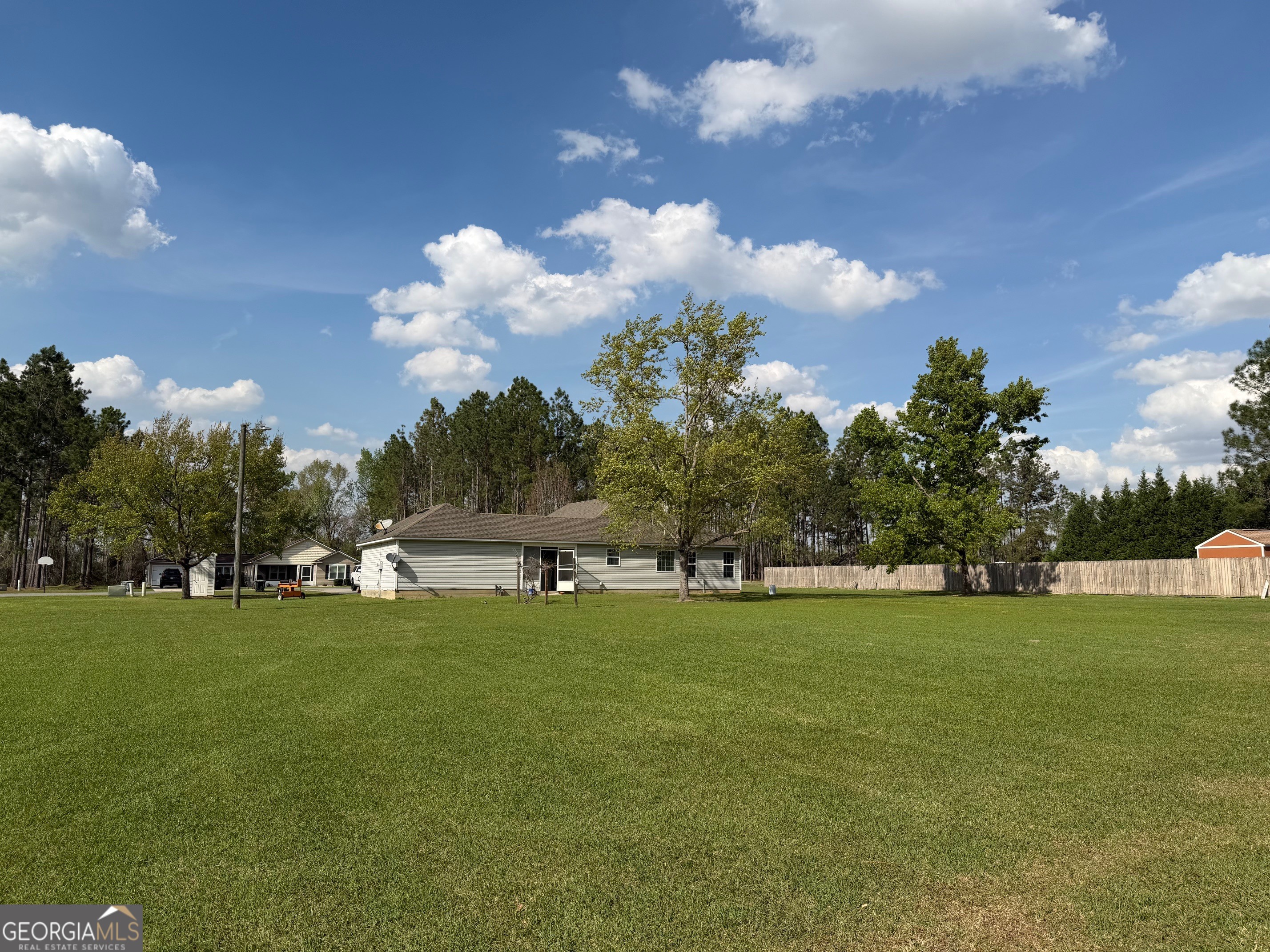 257 Mountain Laurel Road Nashville, GA 31639 - Photo 35 of 41 a view of a golf course with a lake