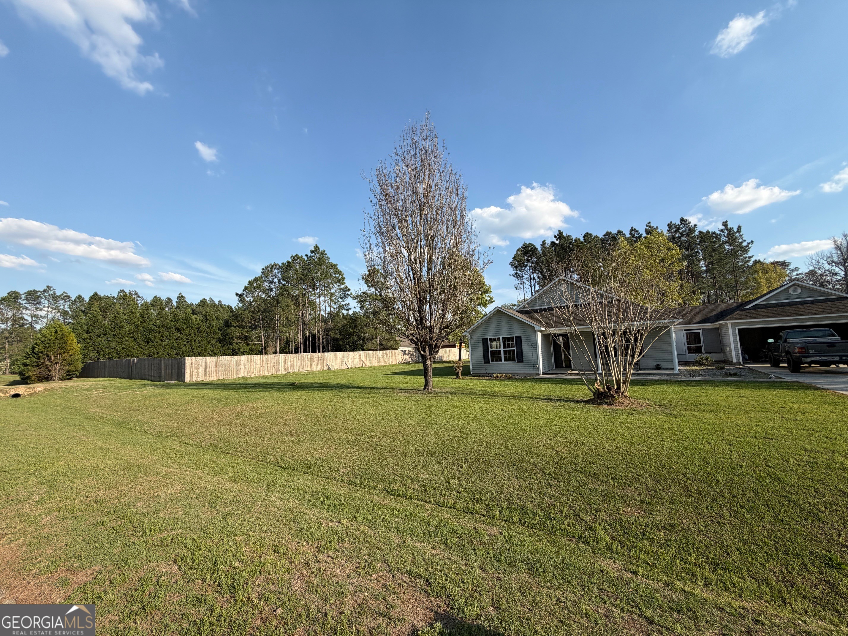 257 Mountain Laurel Road Nashville, GA 31639 - Photo 40 of 41 a view of big yard in front of house with trees