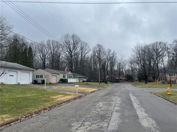 a view of a playground with basketball court