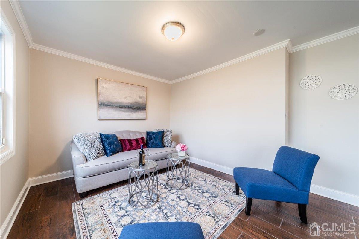 44 Rosewood Road Edison, NJ 08817 - Photo 4 of 33 a living room with furniture and a couch