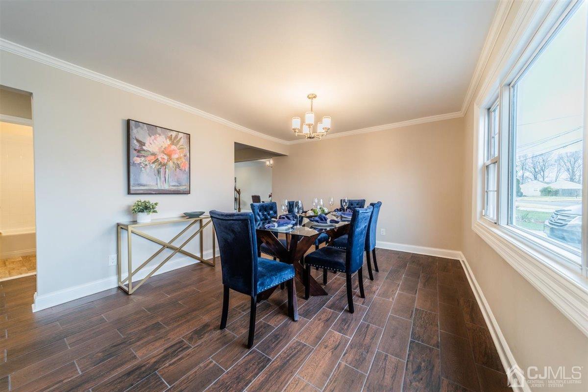 44 Rosewood Road Edison, NJ 08817 - Photo 5 of 33 a view of a dining room with furniture window and wooden floor