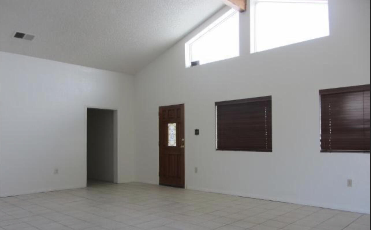48801 97th Street East Lancaster, CA 93535 - Photo 12 of 14 a view of an empty room with window
