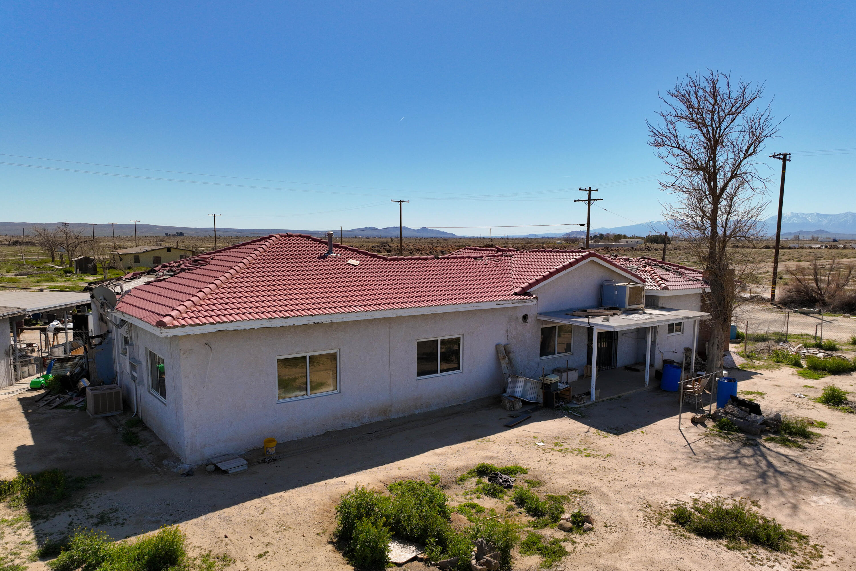 48801 97th Street East Lancaster, CA 93535 - Photo 3 of 14 a front view of a house with a yard