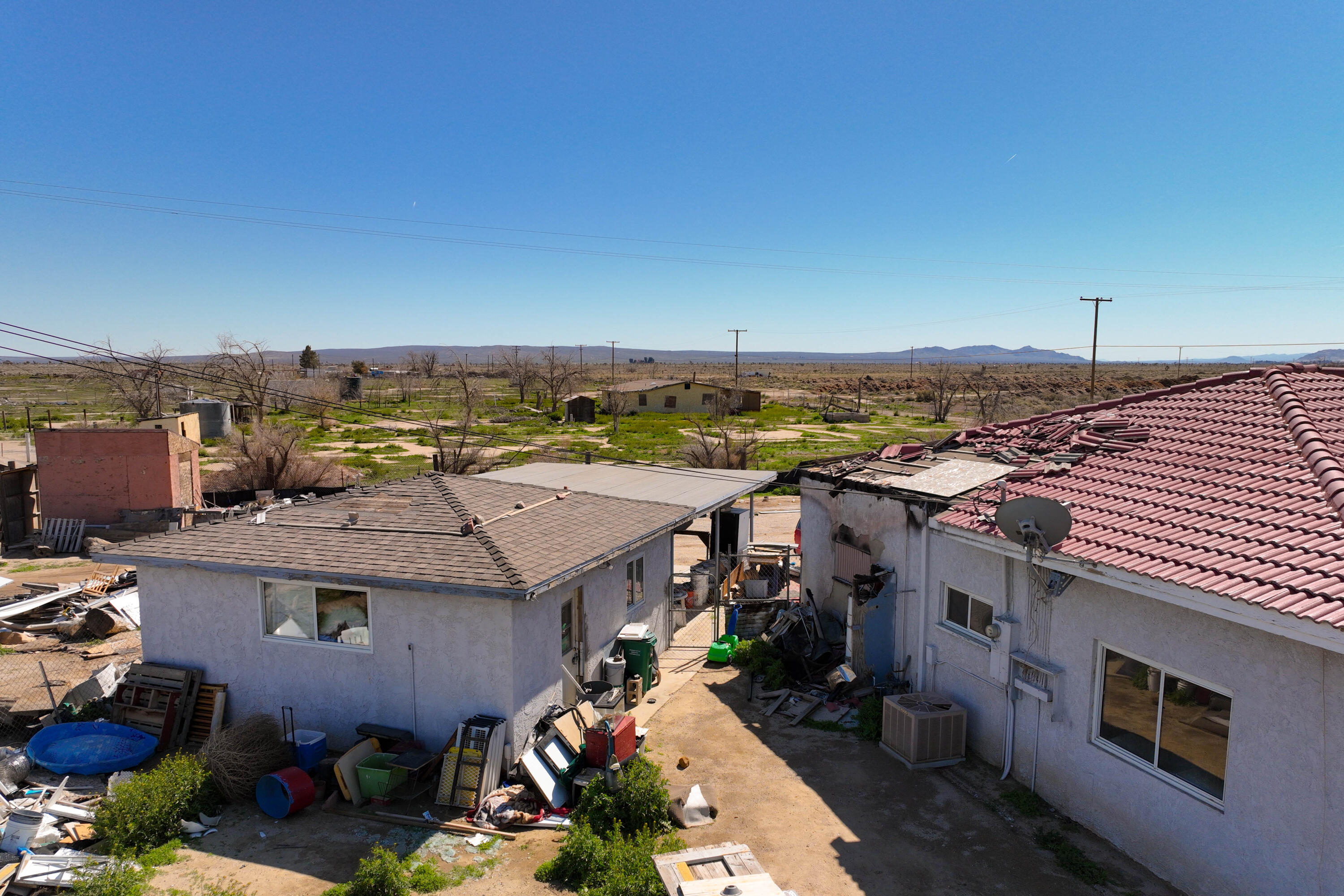 48801 97th Street East Lancaster, CA 93535 - Photo 6 of 14 an aerial view of a house with a garden