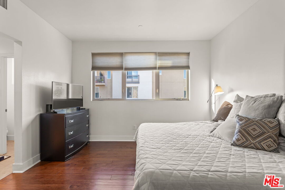 25 Delancy Irvine, CA 92612 - Photo 14 of 41 a bedroom with a bed and a flat screen tv