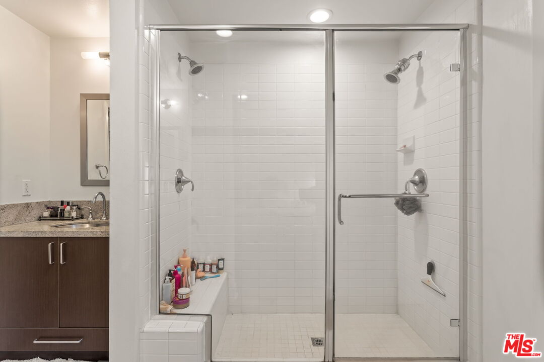 25 Delancy Irvine, CA 92612 - Photo 18 of 41 a bathroom with a shower and a sink