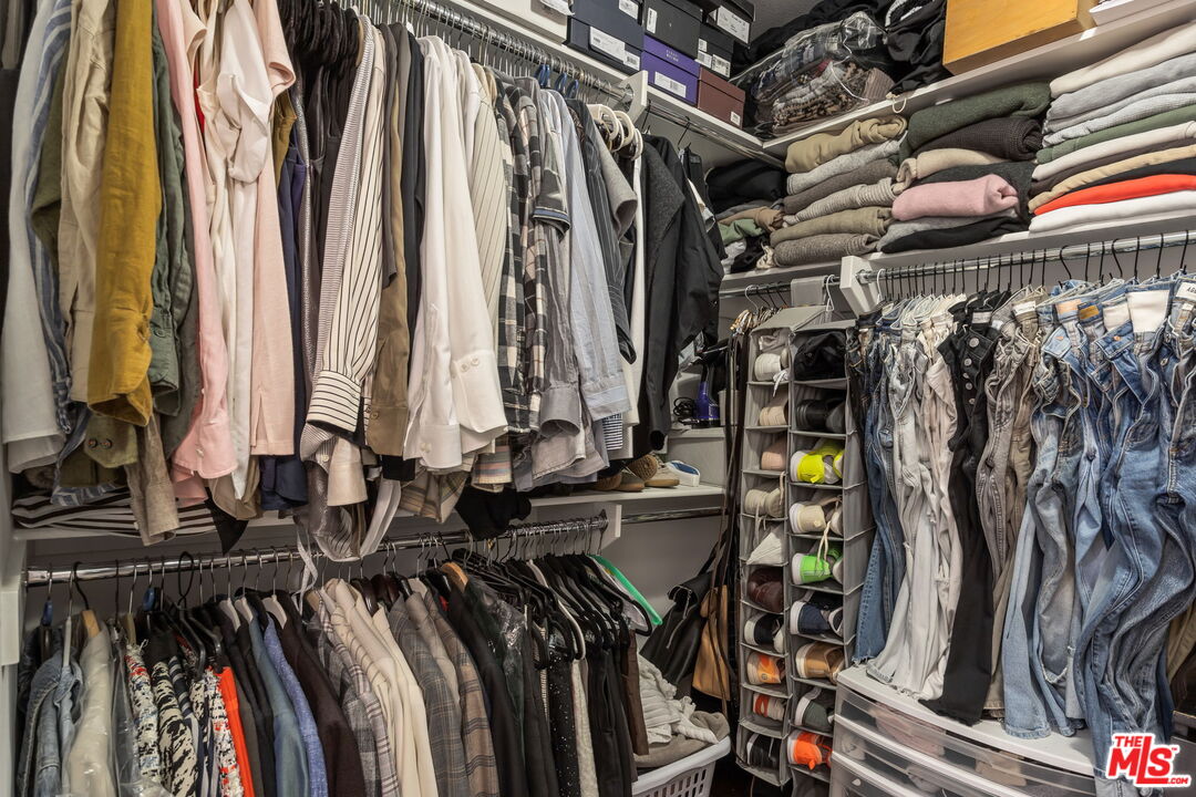 25 Delancy Irvine, CA 92612 - Photo 21 of 41 a view of walk in closet with clothes and shoes