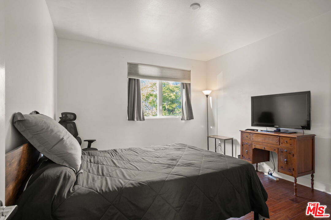 25 Delancy Irvine, CA 92612 - Photo 25 of 41 a bedroom with a bed and a flat screen tv