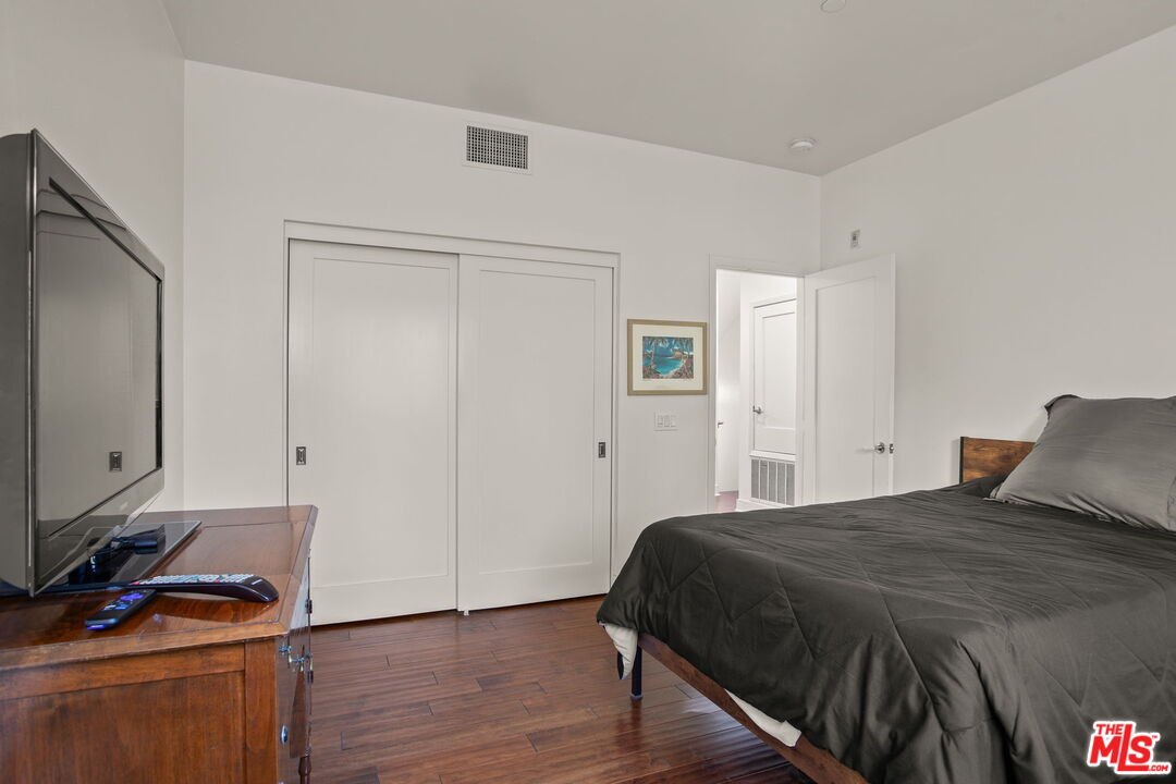 25 Delancy Irvine, CA 92612 - Photo 27 of 41 a bedroom with a bed and a flat tv screen