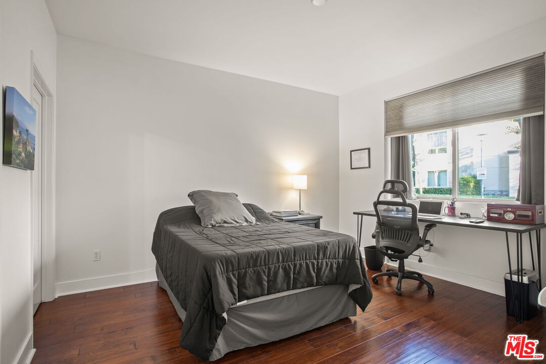 25 Delancy Irvine, CA 92612 - Photo 30 of 41 a bedroom with a bed and a desk