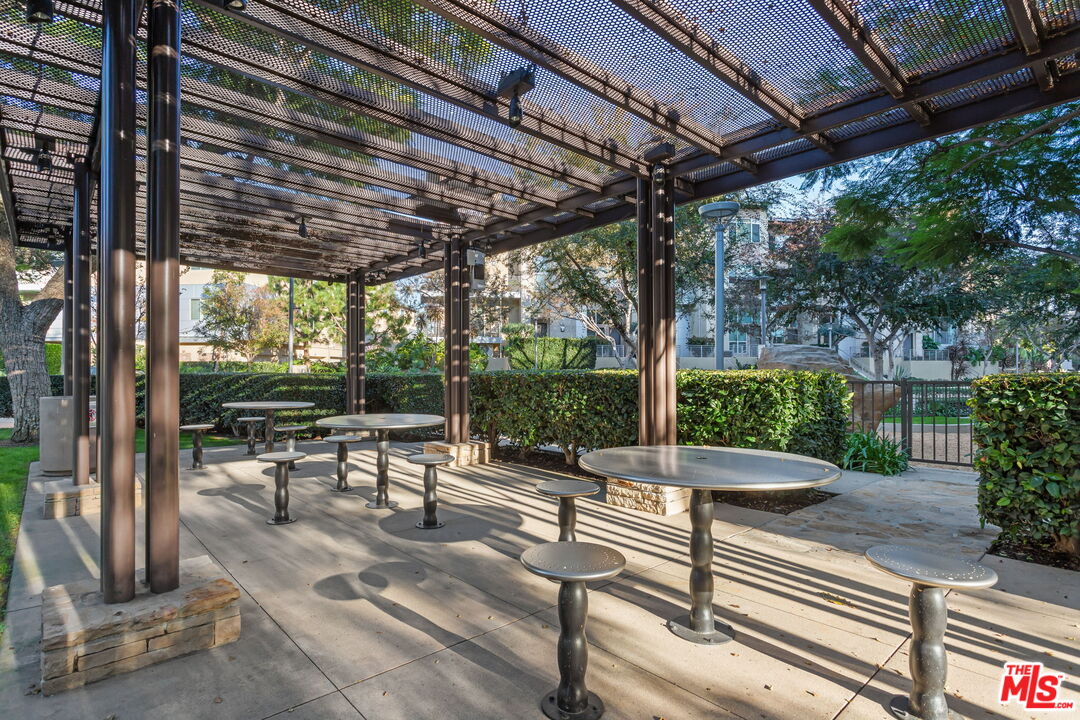 25 Delancy Irvine, CA 92612 - Photo 38 of 41 a view of a patio with table and chairs potted plants with wooden floor and fence