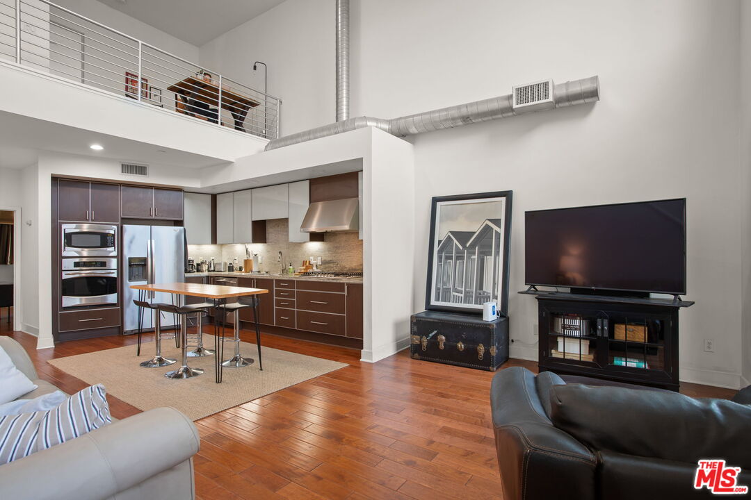 25 Delancy Irvine, CA 92612 - Photo 9 of 41 a living room with furniture and a flat screen tv