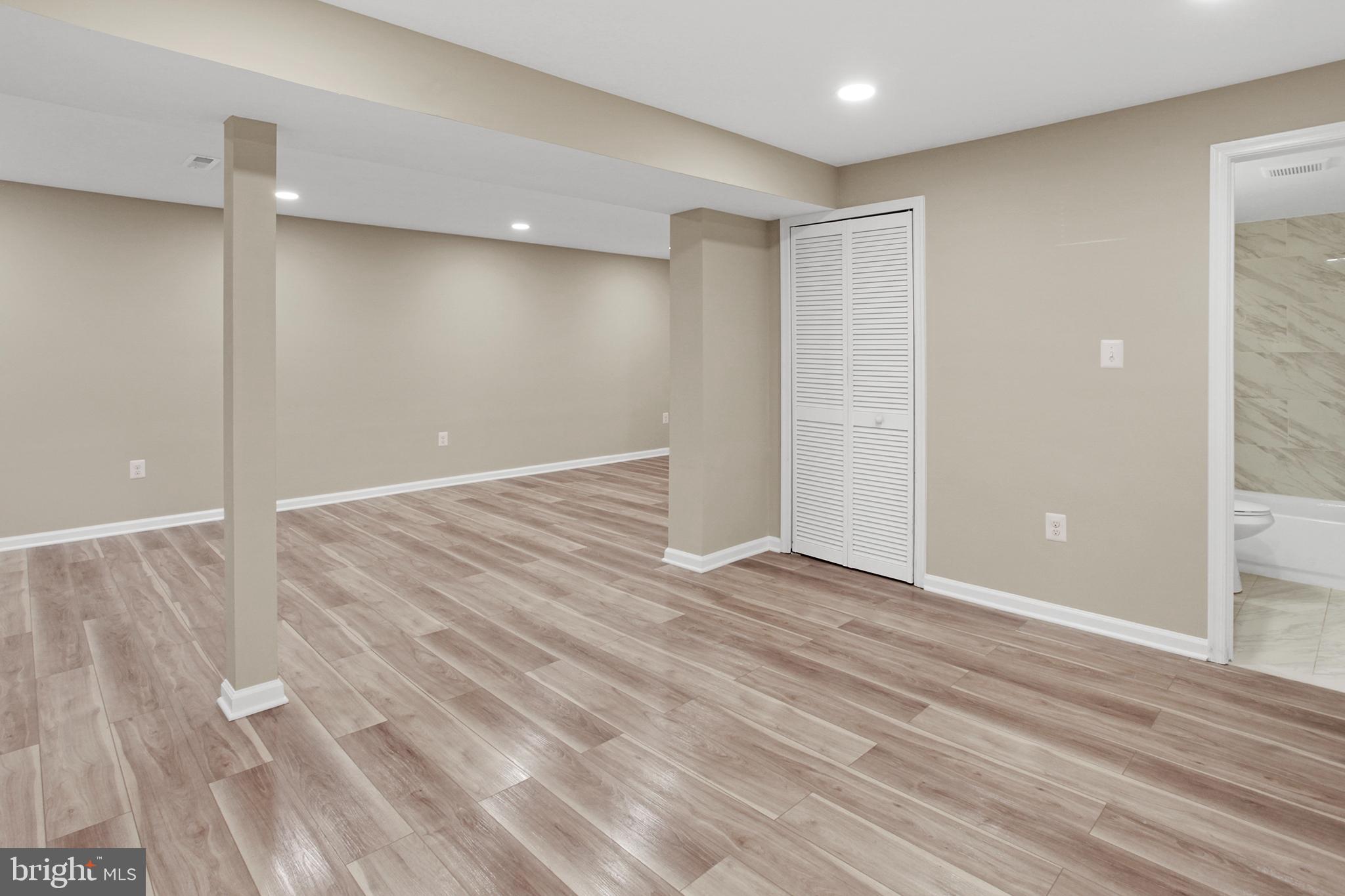 133 Oakview Drive Southeast Leesburg, VA 20175 - Photo 16 of 32 lower level rec room (utility closet on right)