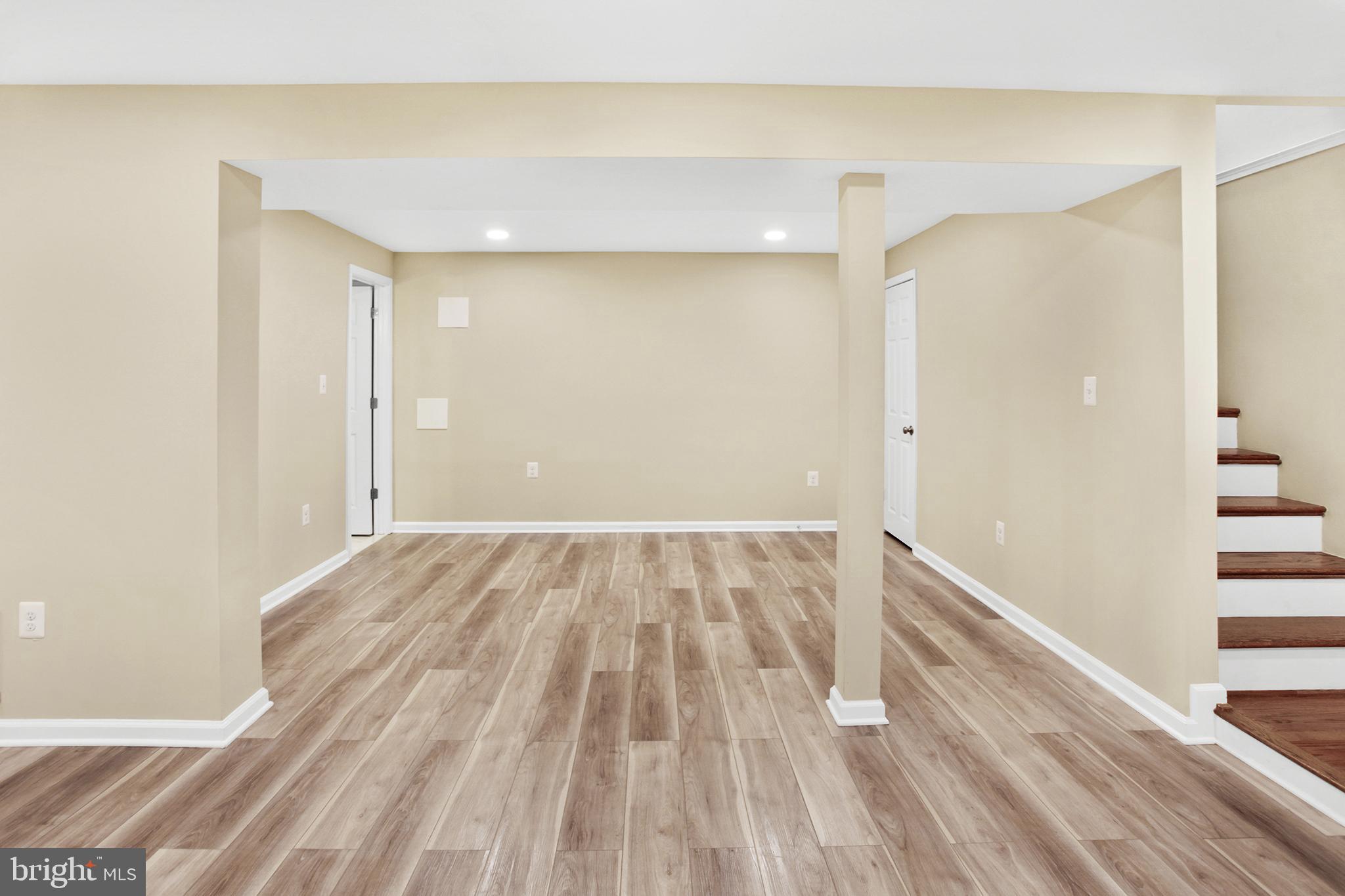 133 Oakview Drive Southeast Leesburg, VA 20175 - Photo 18 of 32 lower level rec room (bathroom door on left )