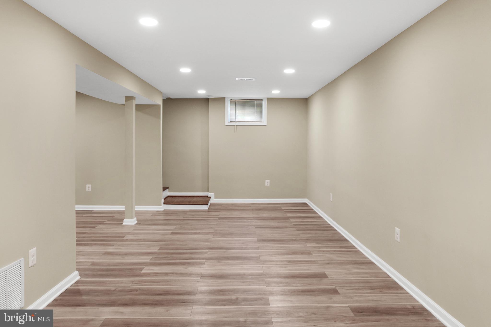 133 Oakview Drive Southeast Leesburg, VA 20175 - Photo 19 of 32 lower level rec room from bonus room toward stairs