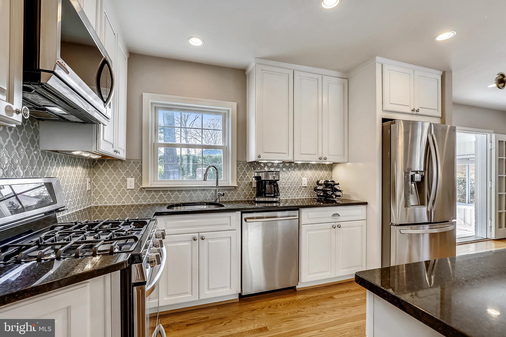 1602 Sherwood Road Silver Spring, MD 20902 - Photo 14 of 41 Gas range and loads of white cabinetry