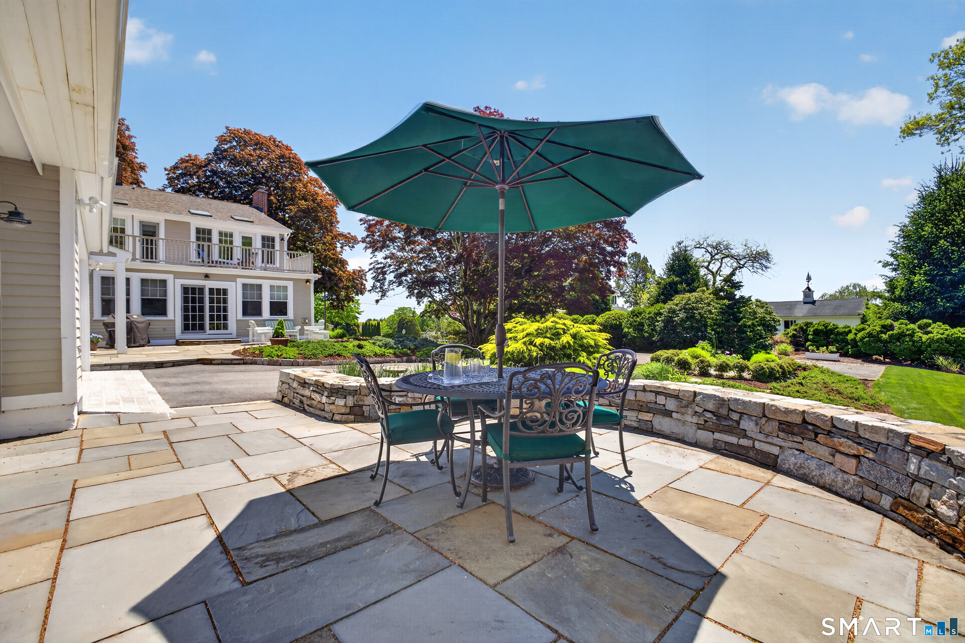 10 Prospect Street Groton, CT 06355 - Photo 4 of 40 a view of a patio with a table and chairs under an umbrella