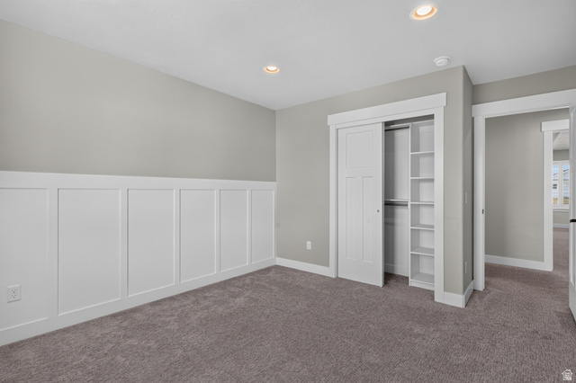36 West Syracuse Road Vineyard, UT 84059 - Photo 37 of 56 Carpeted room featuring wainscoting, recessed lighting, and a closet with bifold doors and built-in shelving