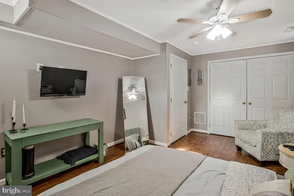 a bedroom with furniture and a fireplace