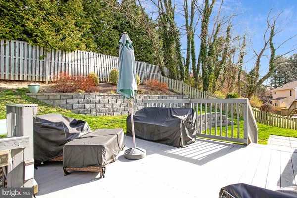 a view of backyard with outdoor seating and trees