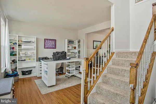 a work room with furniture and wooden floor
