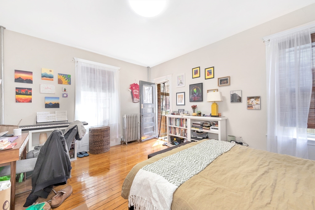 104 Strathmore Road Boston, MA 02135 - Photo 19 of 41 a bed room with a bed and a closet