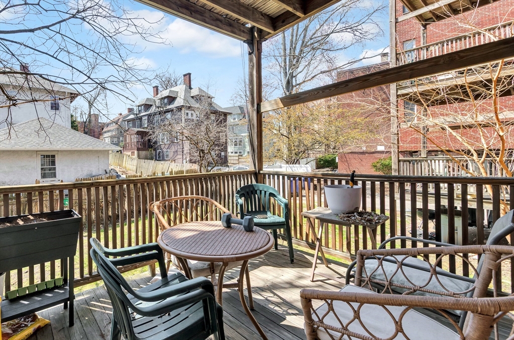 104 Strathmore Road Boston, MA 02135 - Photo 20 of 41 a view of a chairs and table in the balcony