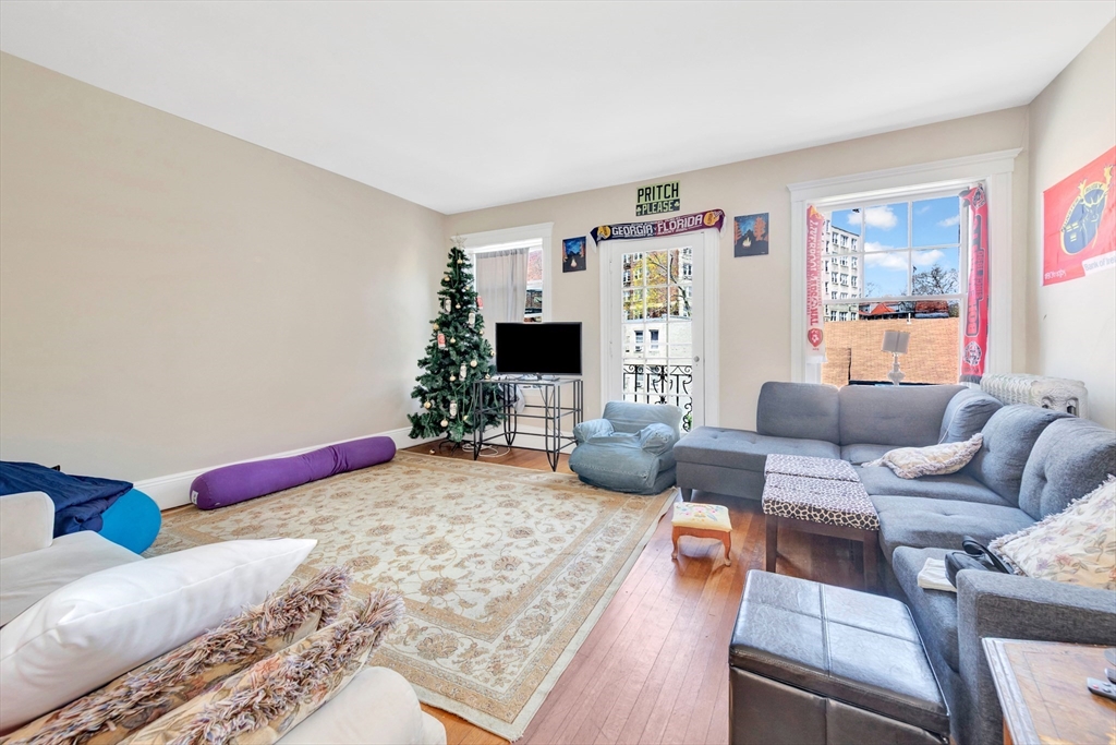 104 Strathmore Road Boston, MA 02135 - Photo 31 of 41 a living room with furniture and a flat screen tv