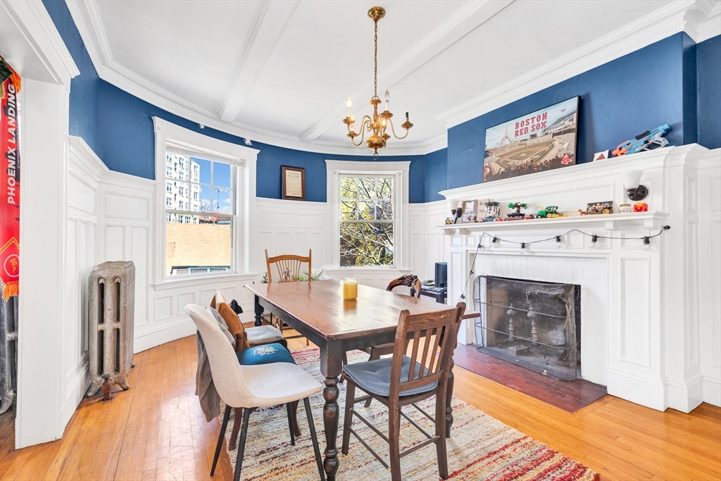 104 Strathmore Road Boston, MA 02135 - Photo 33 of 41 a view of a dining room with furniture window and wooden floor